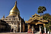 Bagan Myanmar. Next to the Gubyaukgyi stands the gilded Myazedi or 'Emerald Stupa'. 